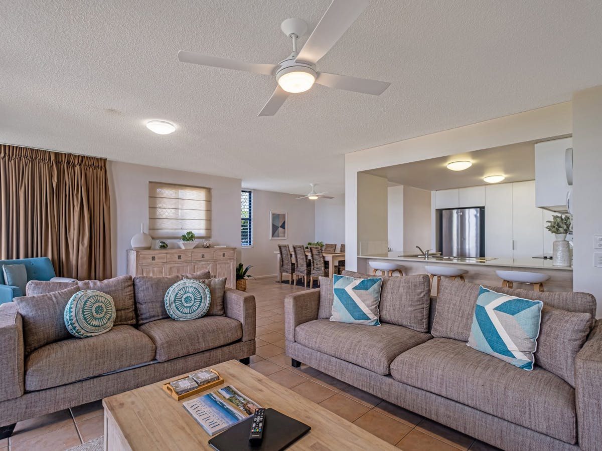 Open plan lounge area with Smart TV and balcony access