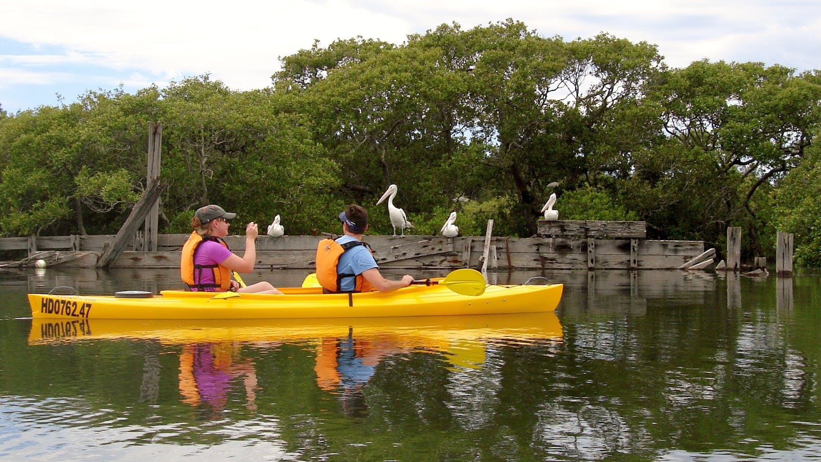Customers in double taking photo near shipwreck