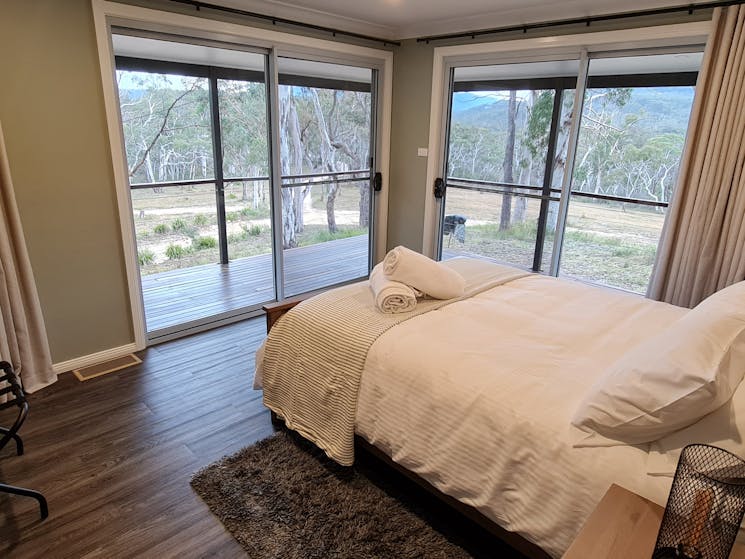 Main bedroom with Queen bed and ensuite bathroom.  Views of property and escarpment