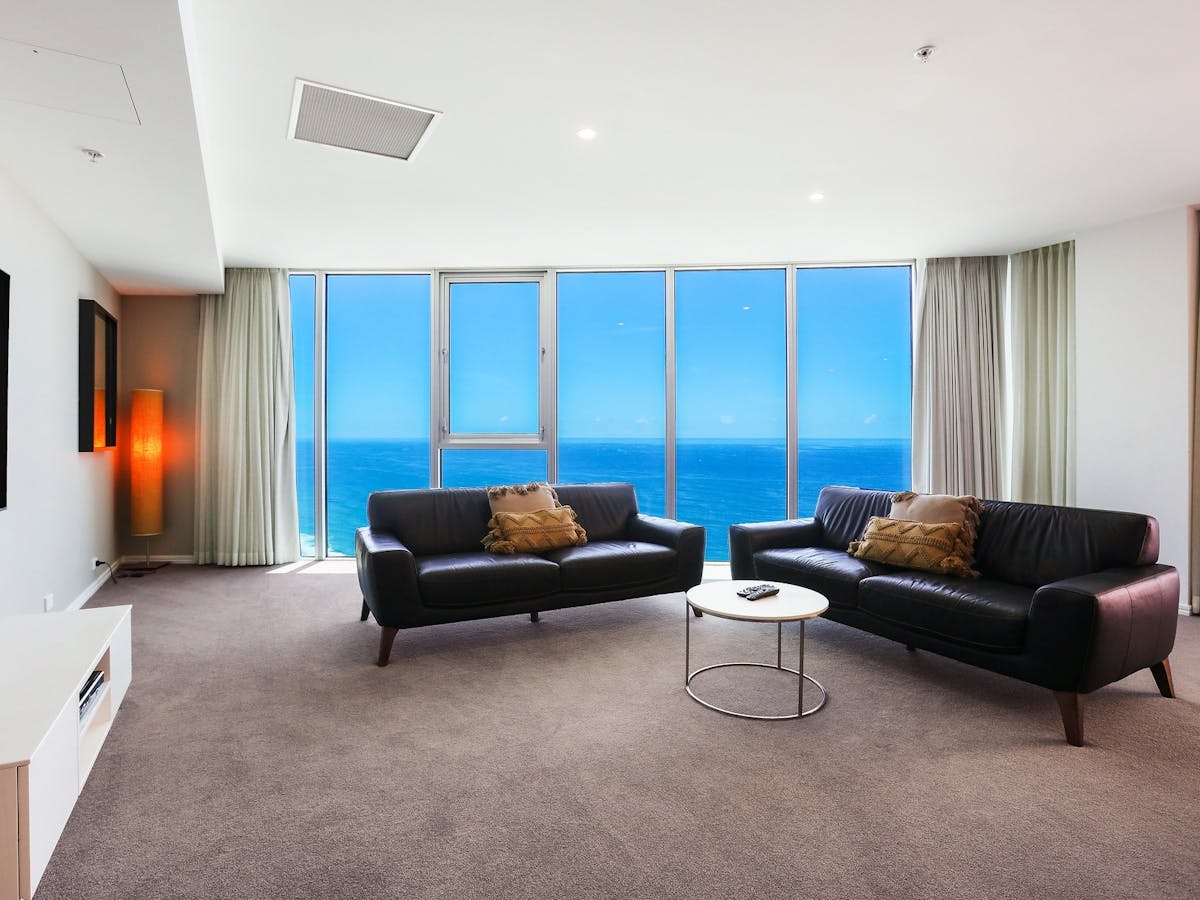Spacious lounge room with ocean view background at the Hilton Surfers Paradise - Gold Coast Holidays Spacious lounge room with ocean view background at the Hilton Surfers Paradise - Gold Coast Holidays