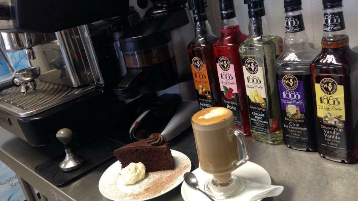 Enjoy a delicious slice of cake with hot coffee.