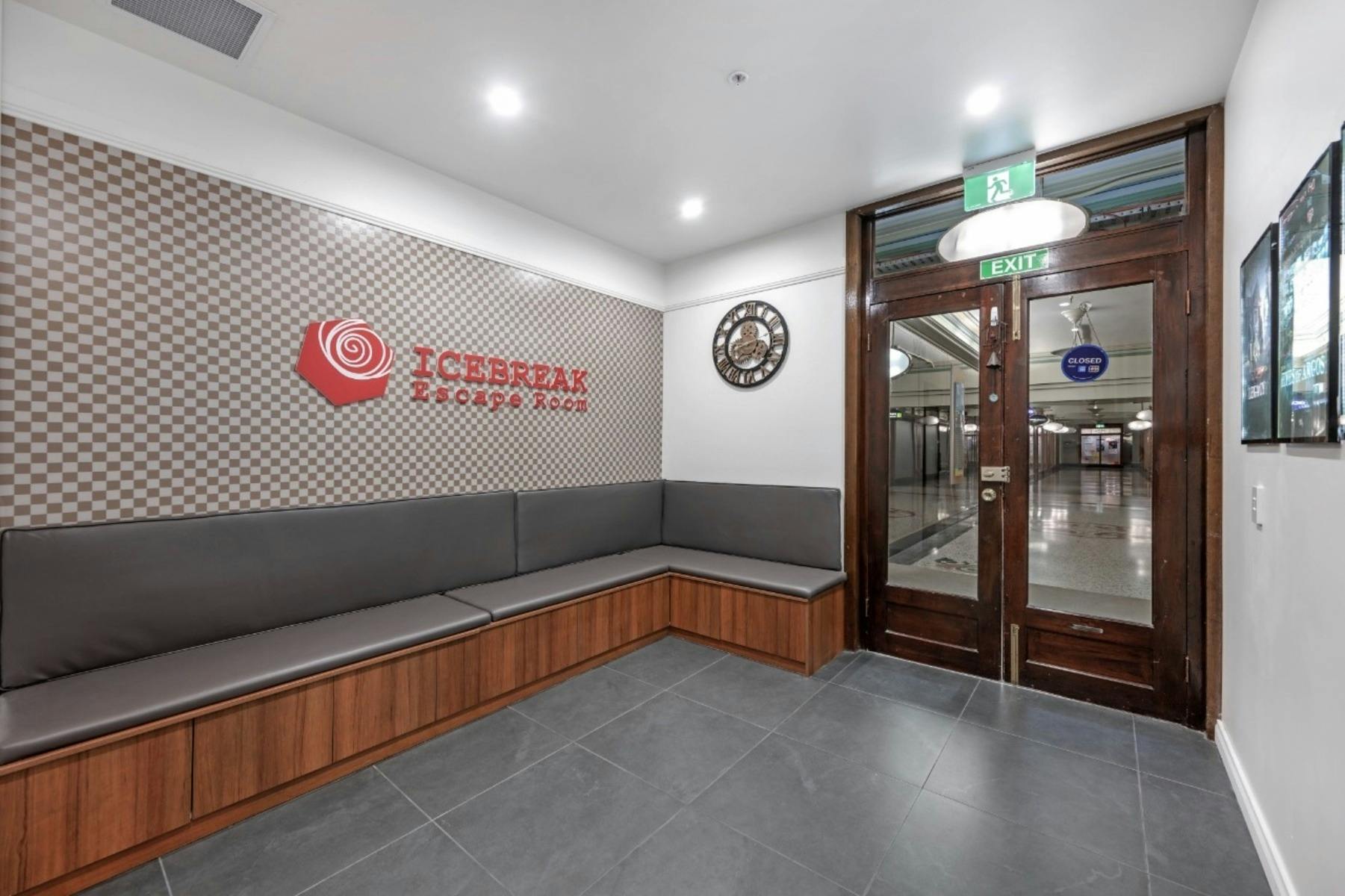 Ice Break Escape Room reception and waiting area in Sydney CBD with logo and seating