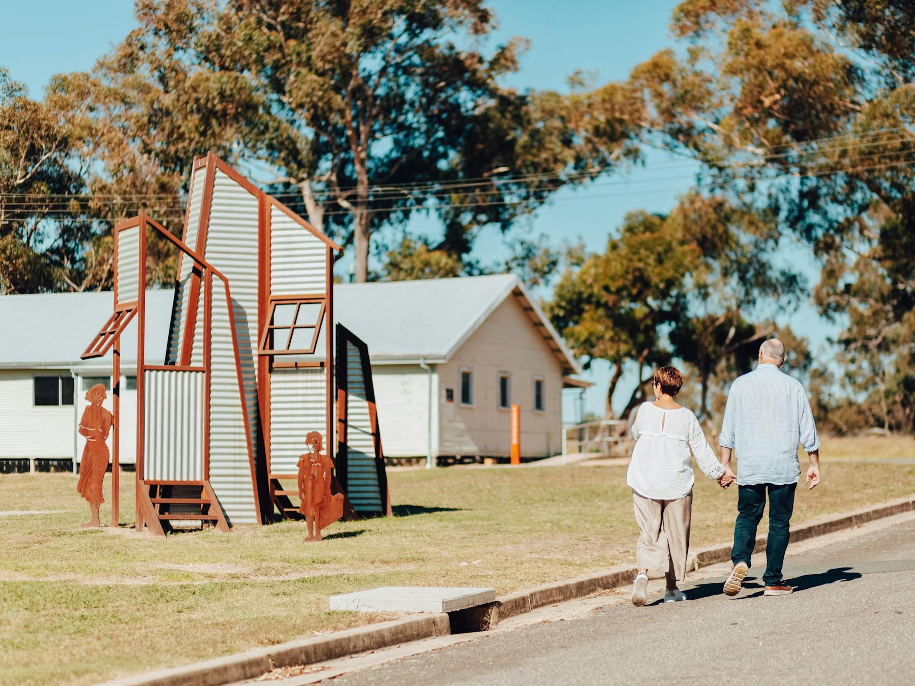 two people walking at the Bonegilla Migrant Experience