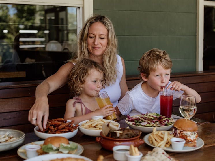 young kids & their mum enjoying fresh juices at Audley Cafe