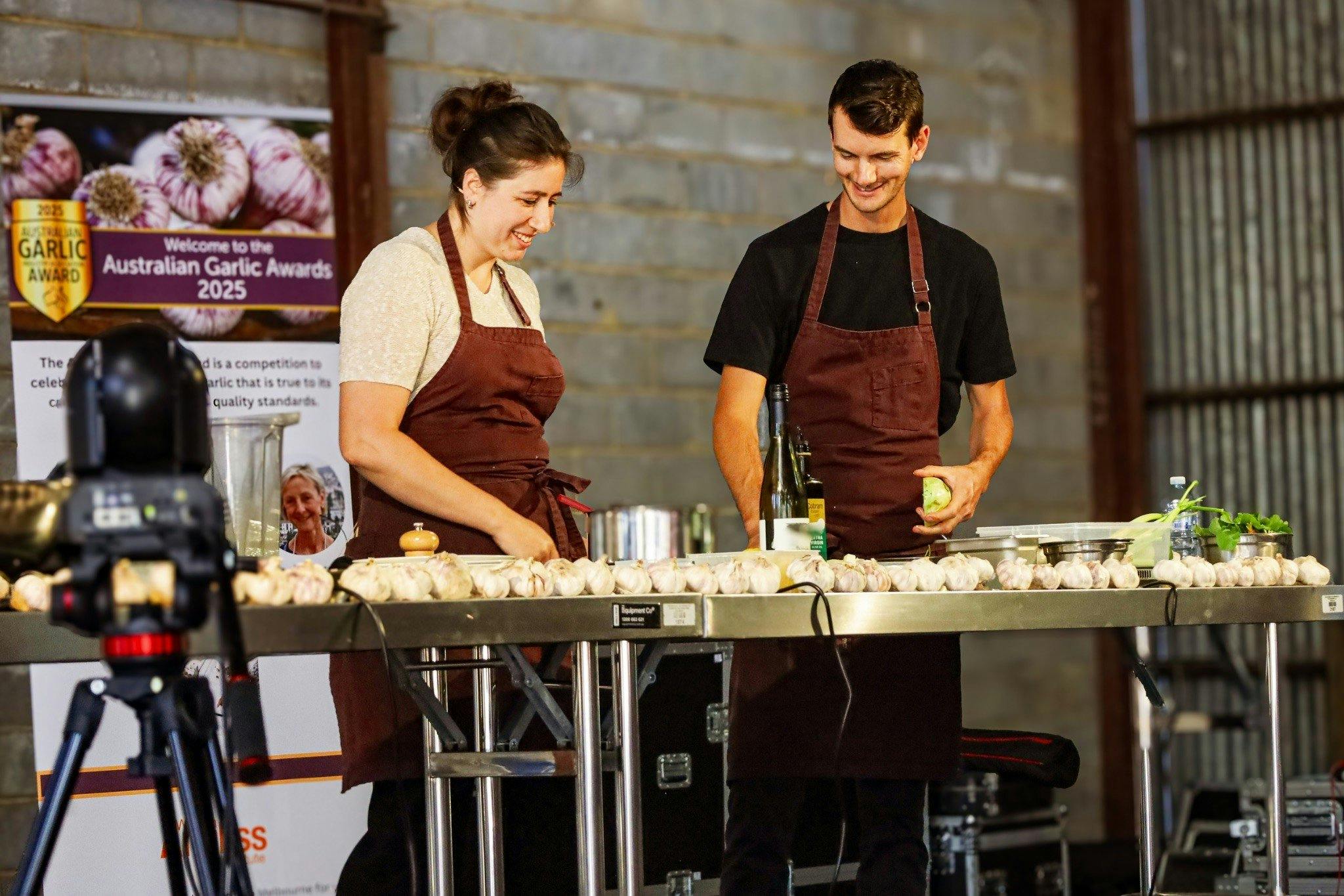 Two people wearing aprons