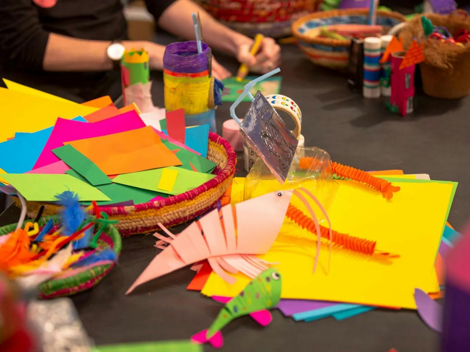 A colour array of crafting materials including paper and pipe cleaners