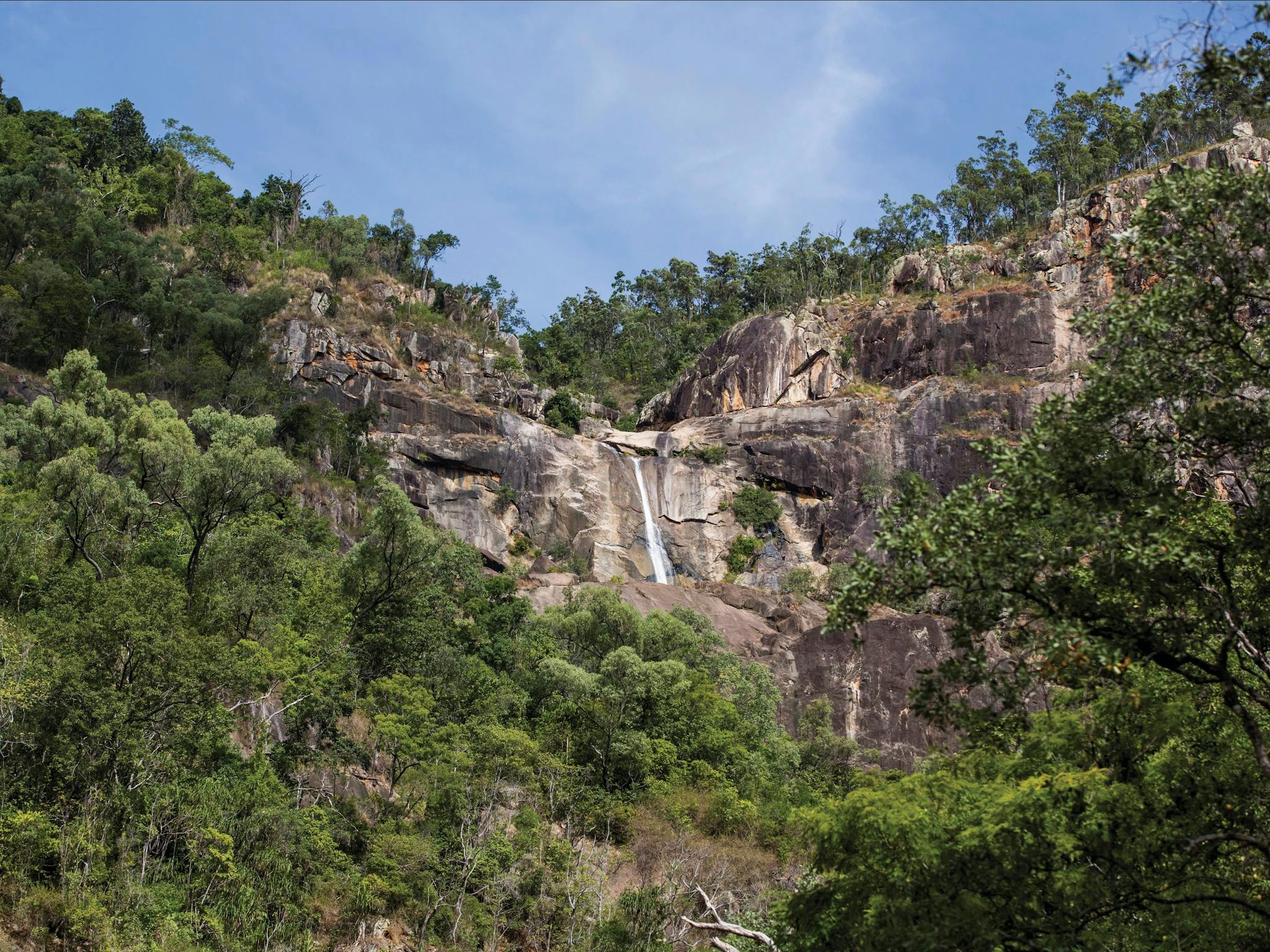 Jourama Falls, cliff face and surrounding woodland. Jourama Falls, cliff face and surrounding woodland.