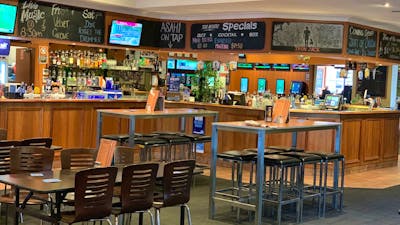 Bar area showing dining tables. No people in photo