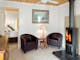 living room with cosy fire at Daisy Hill Lodge