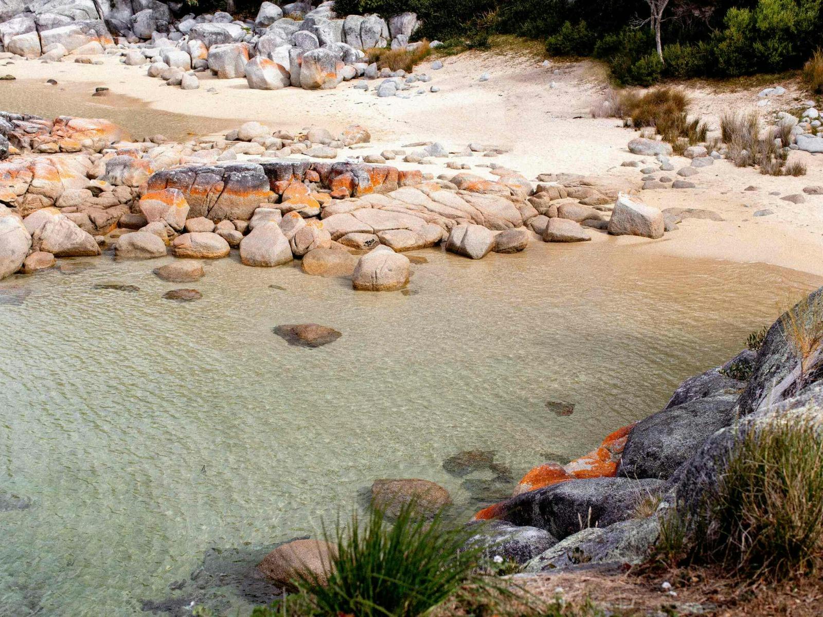 Clear coastal swimming cove near Binalong Bay Beach House, Tasmania.