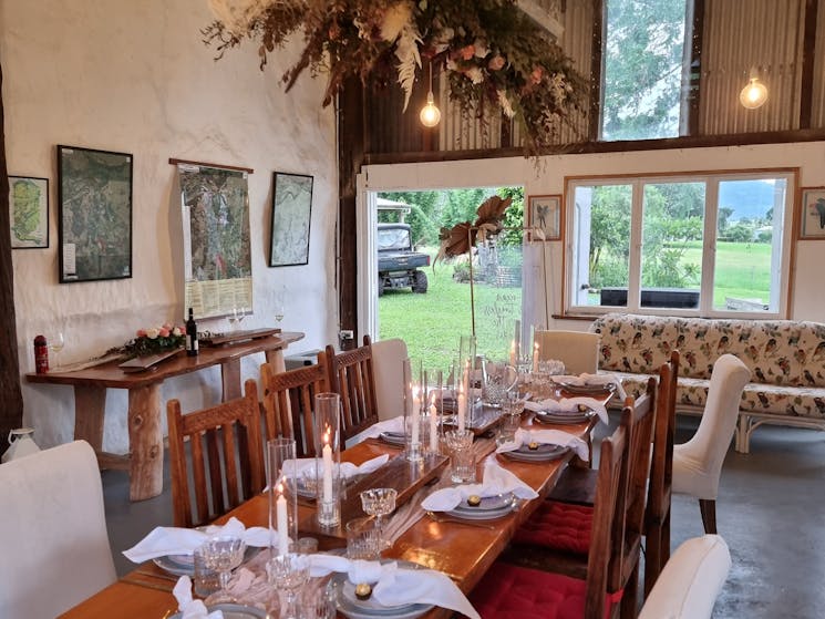 the farmstay banquet barn seats up to 40 guests on long timber tabless