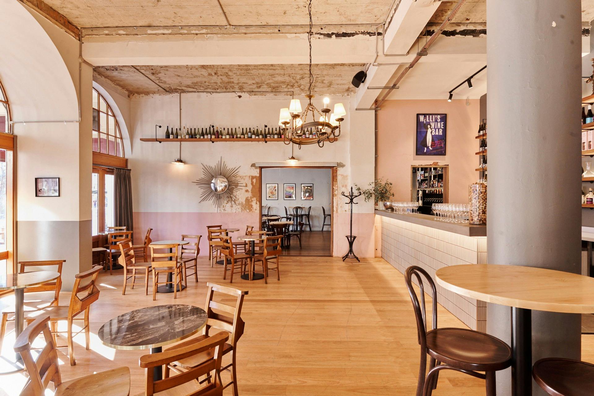 Room with tables and chairs and natural light from sun