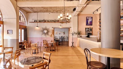 Room with tables and chairs and natural light from sun
