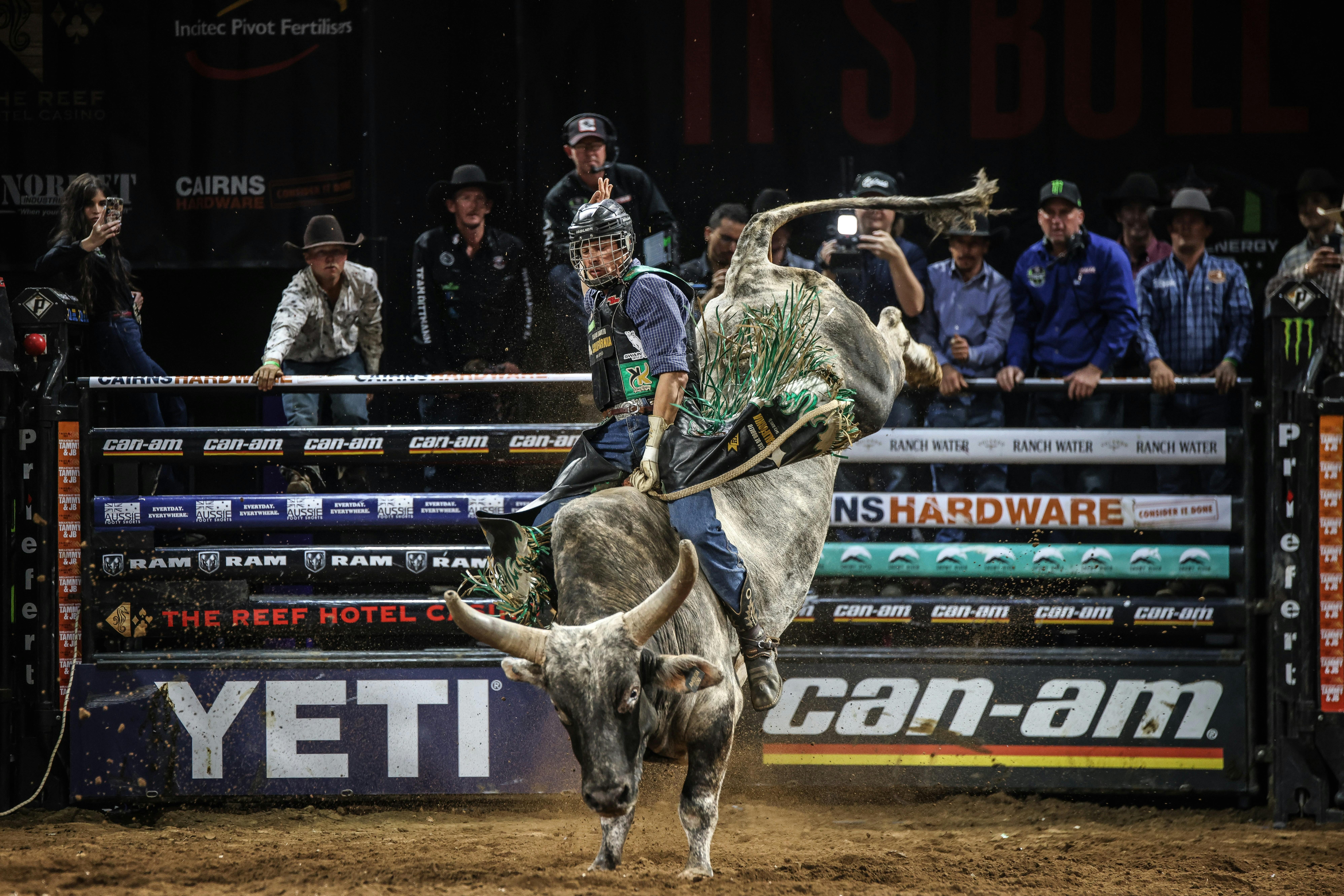 PBR athlete riding bull