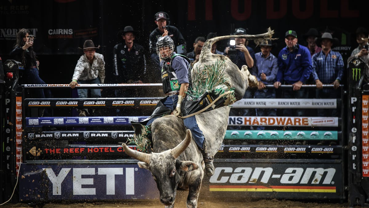 PBR athlete riding bull