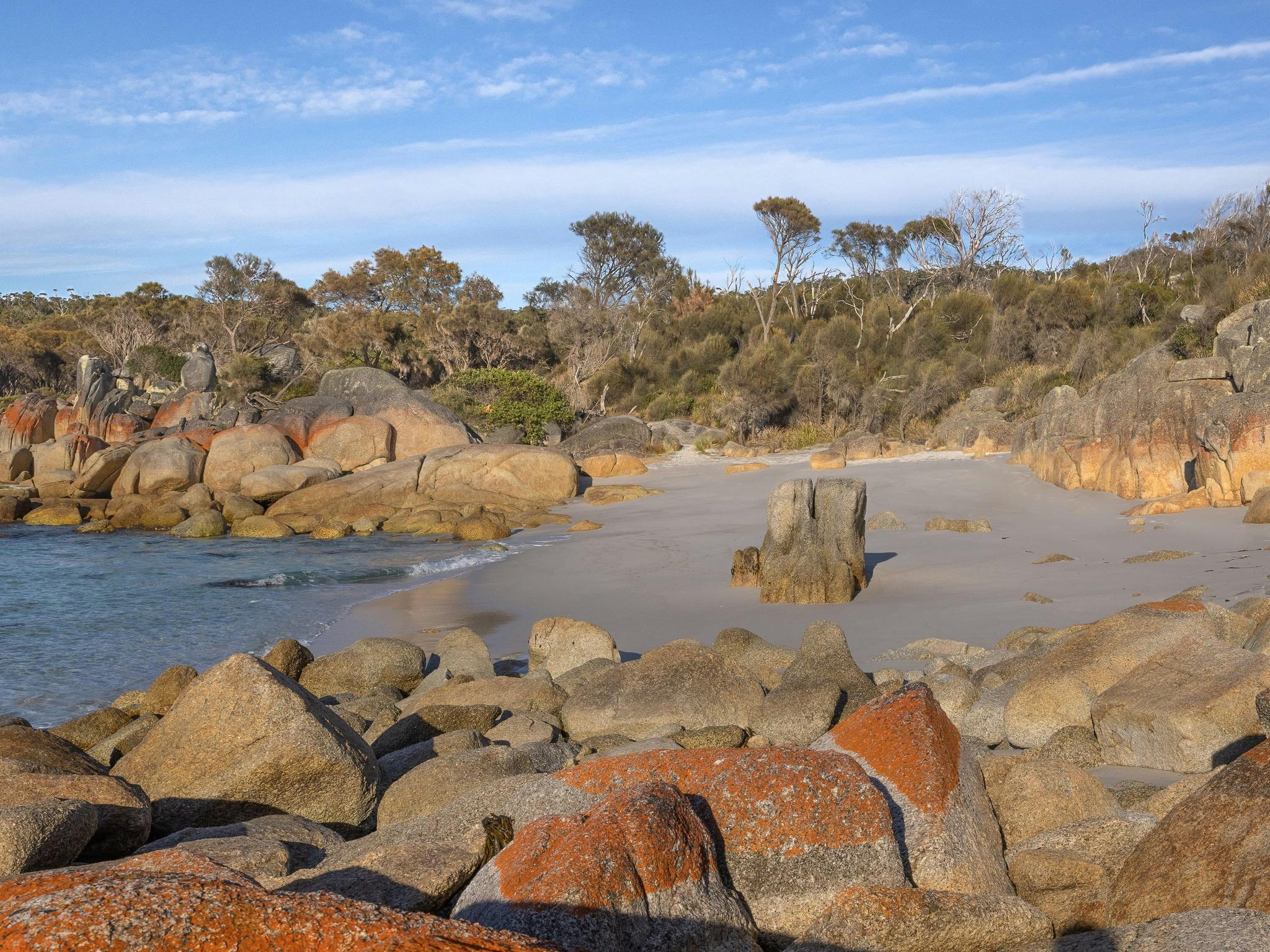 rock lined coastline - sandy beach