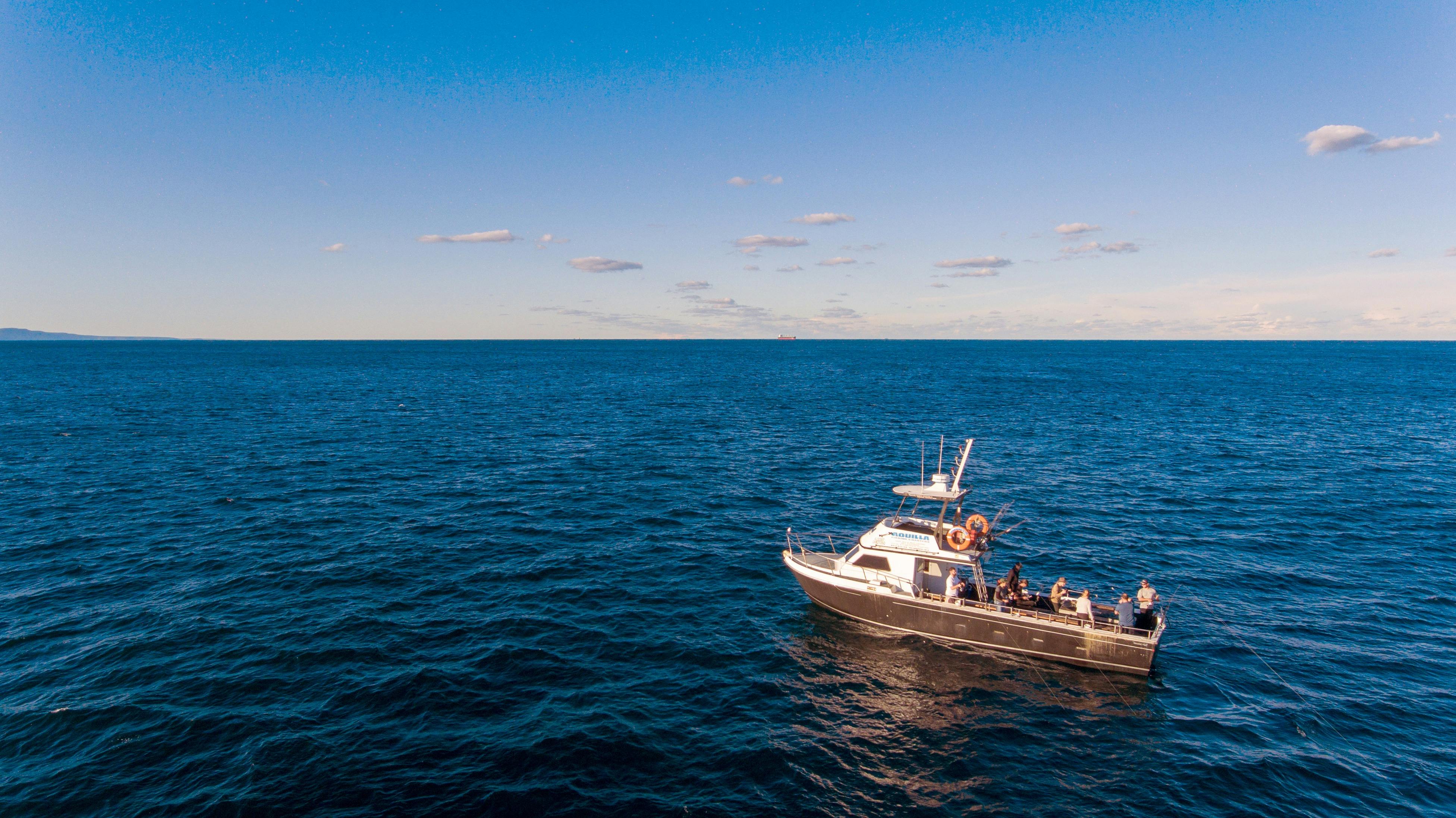 Fishing boat drifting in the open sea