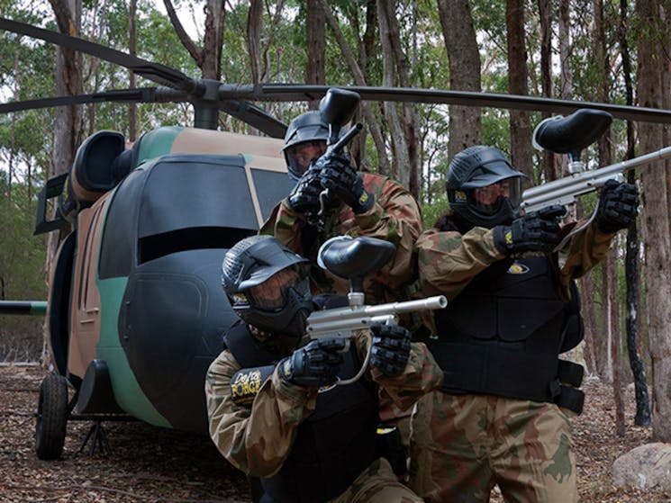 Three men with paintball