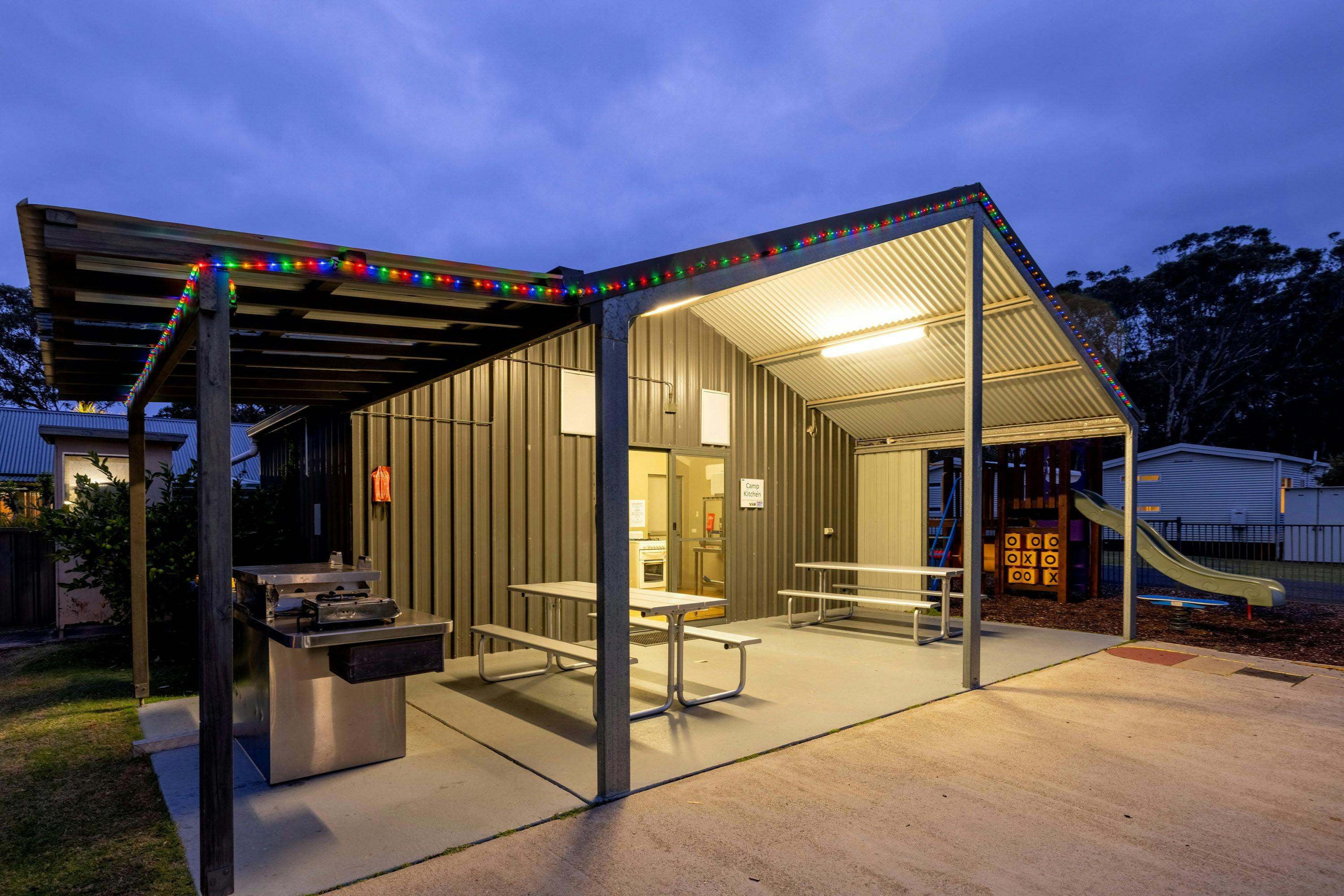 The Camp Kitchen is fully equipped with gas BBQ, fridge, a sink and seating