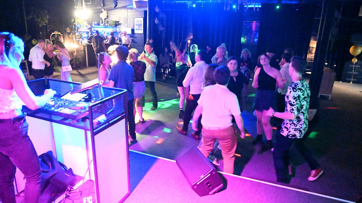 Side stage shot of the dance floor full of people at Club Noir's Night Club Night