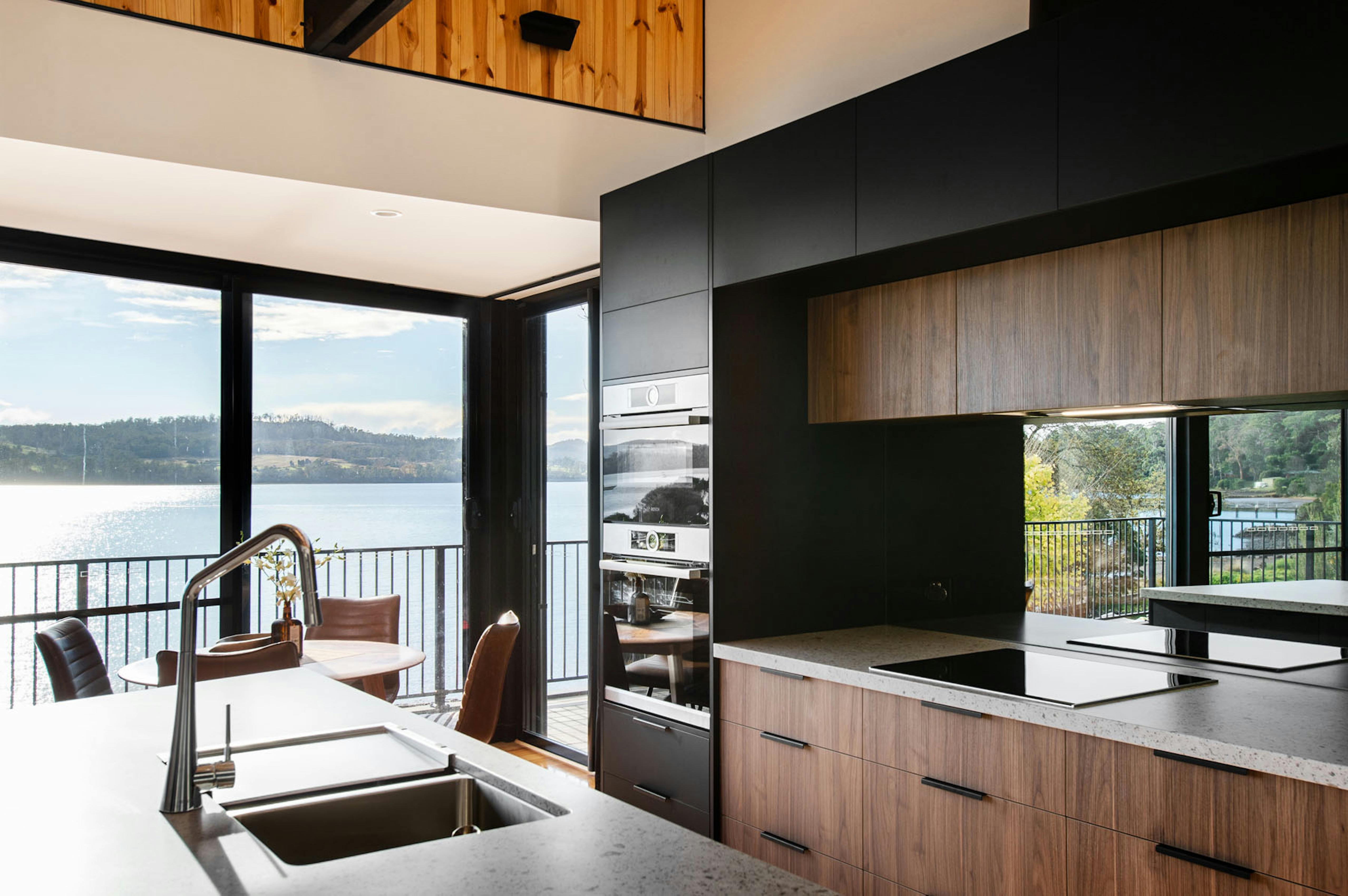 The sleek modern kitchen is a cooks paradise with stunning views of the river.
