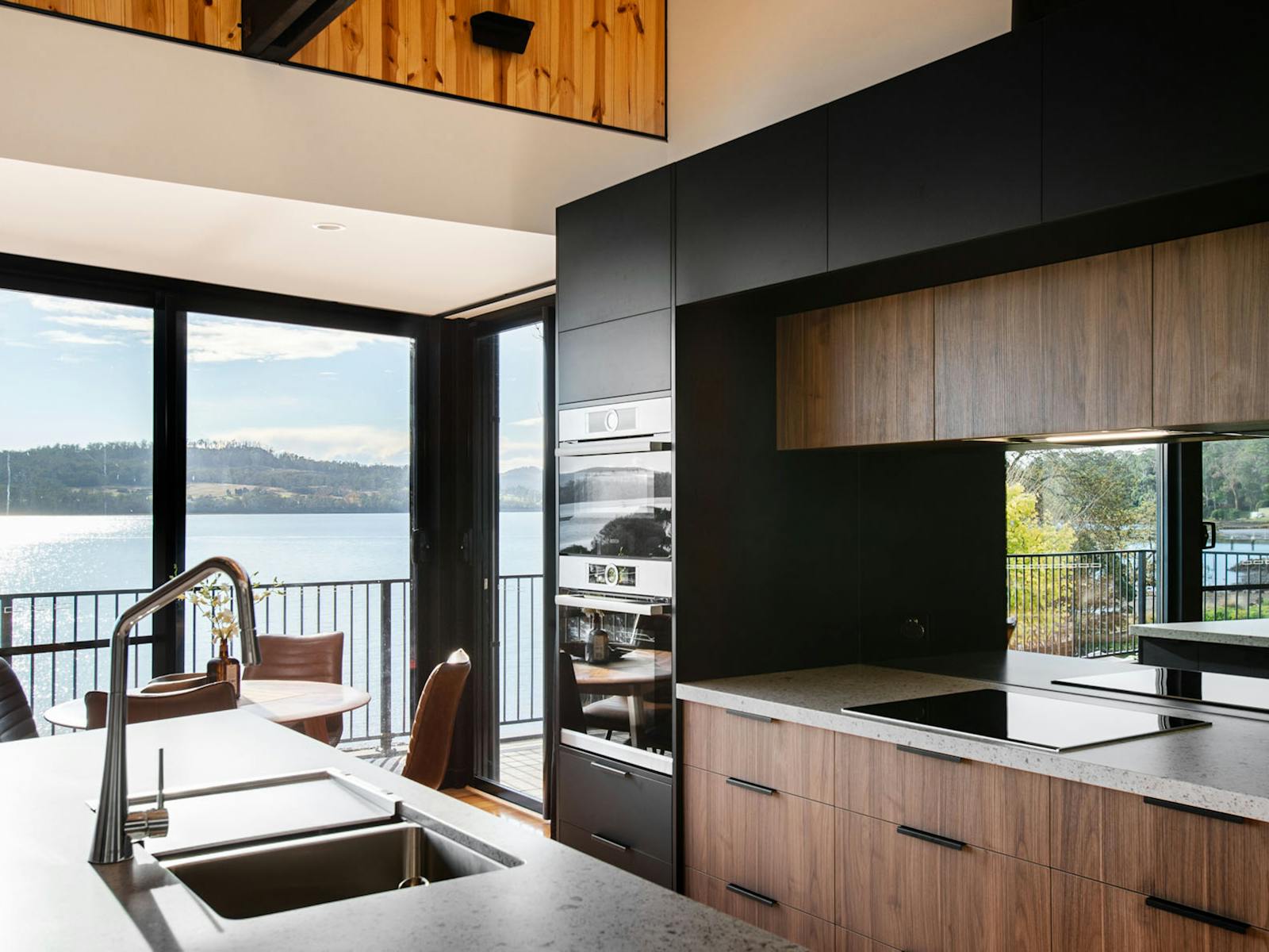 The sleek modern kitchen is a cooks paradise with stunning views of the river.