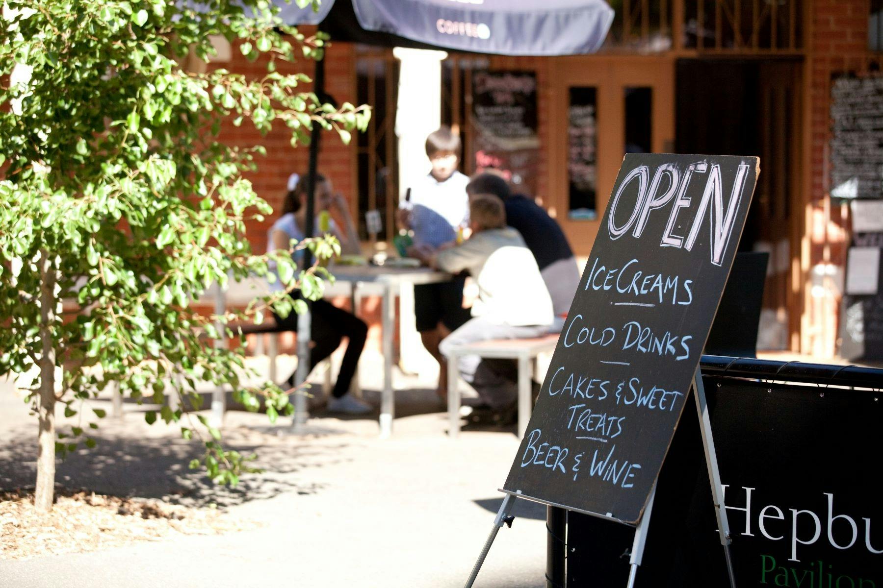 The front of the Pavillion cafe showing a sign