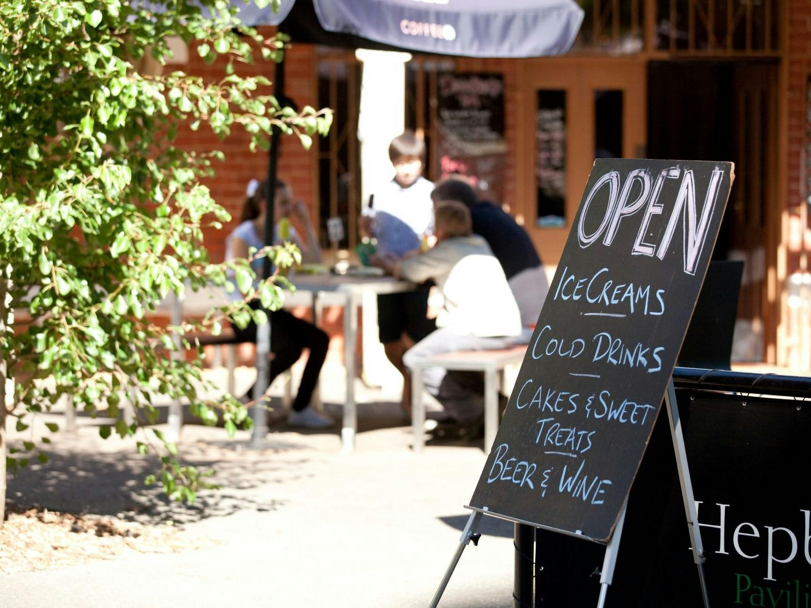 The front of the Pavillion cafe showing a sign
