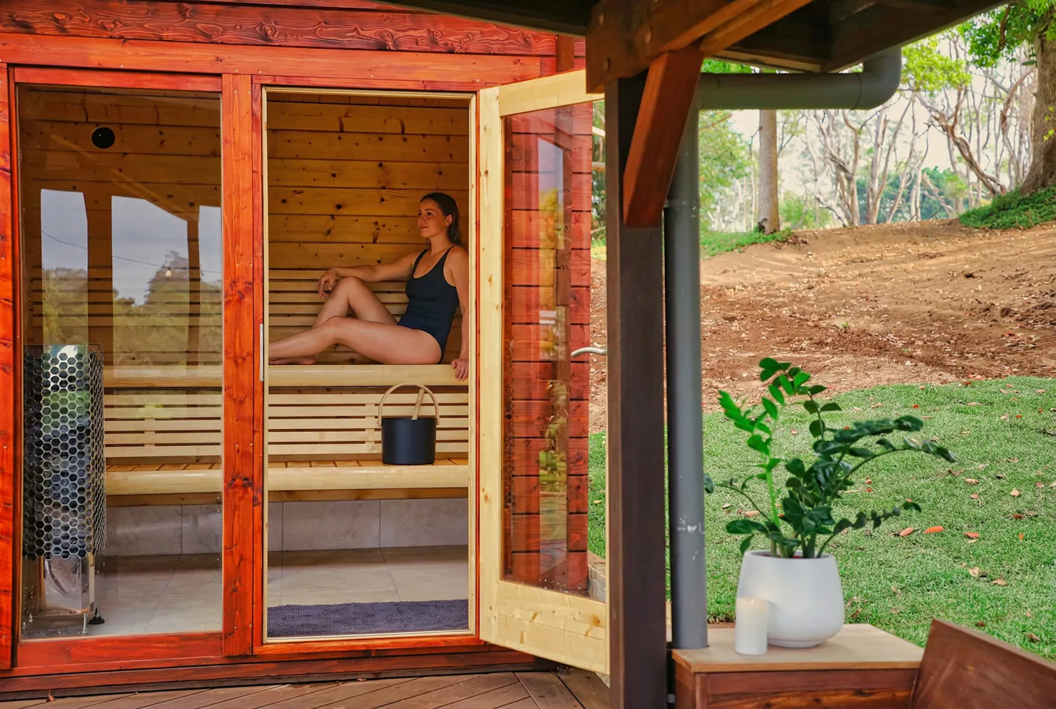 Woman relaxing in Finnish sauna at The Range Holistic Spa and Wellness, Montville Sunshine Coast