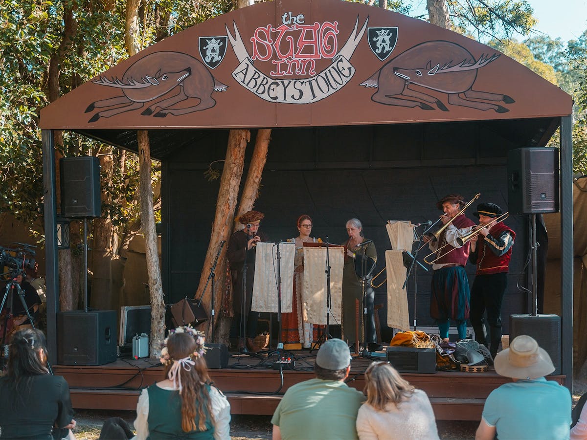 A covered stage at the Stag Inn hosts a musical performance