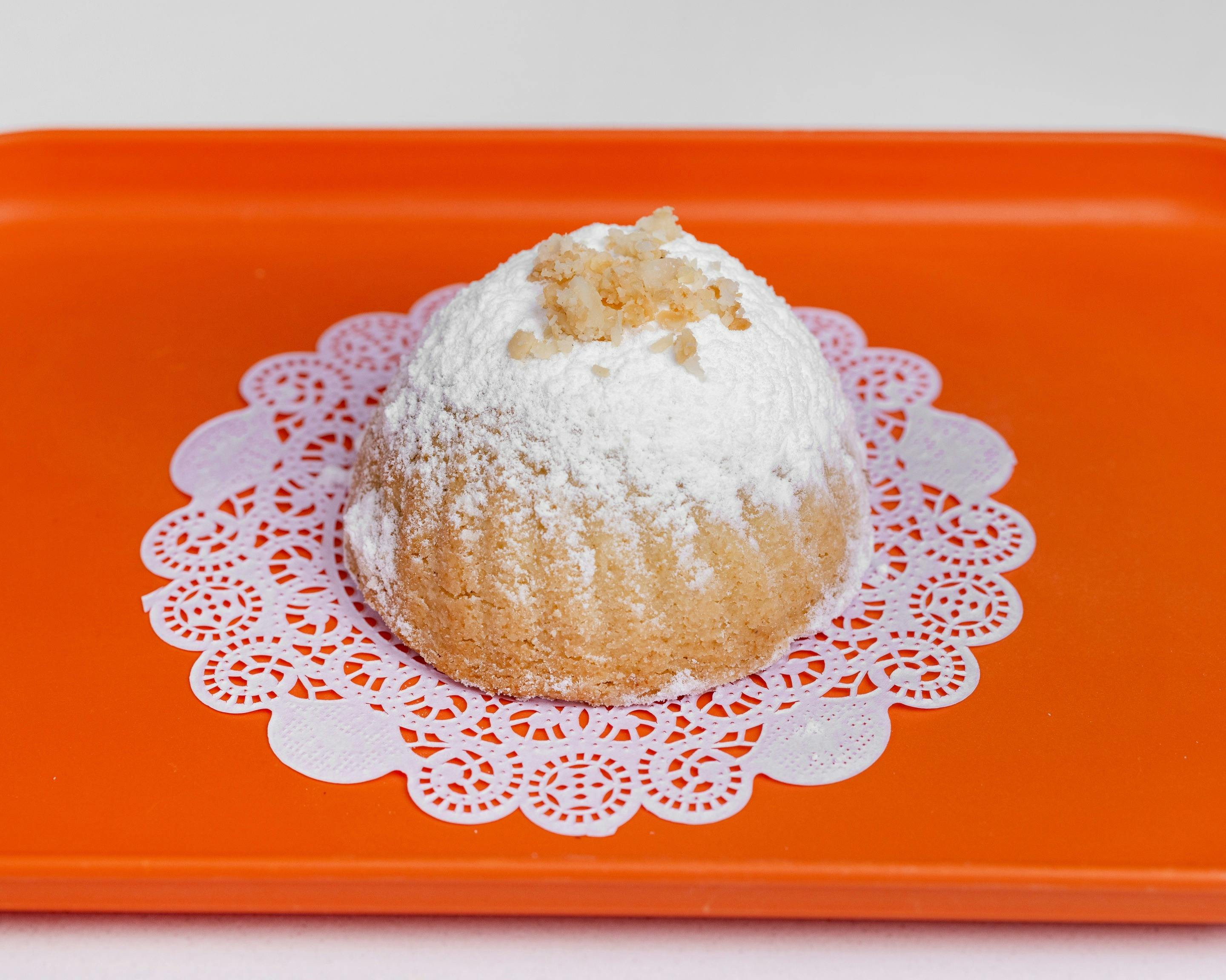 Walnut cake at Smeed on an orange tray