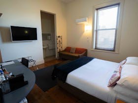 Sleeps 2. King size bed with open plan bathroom. TV with free to air and streaming service access.