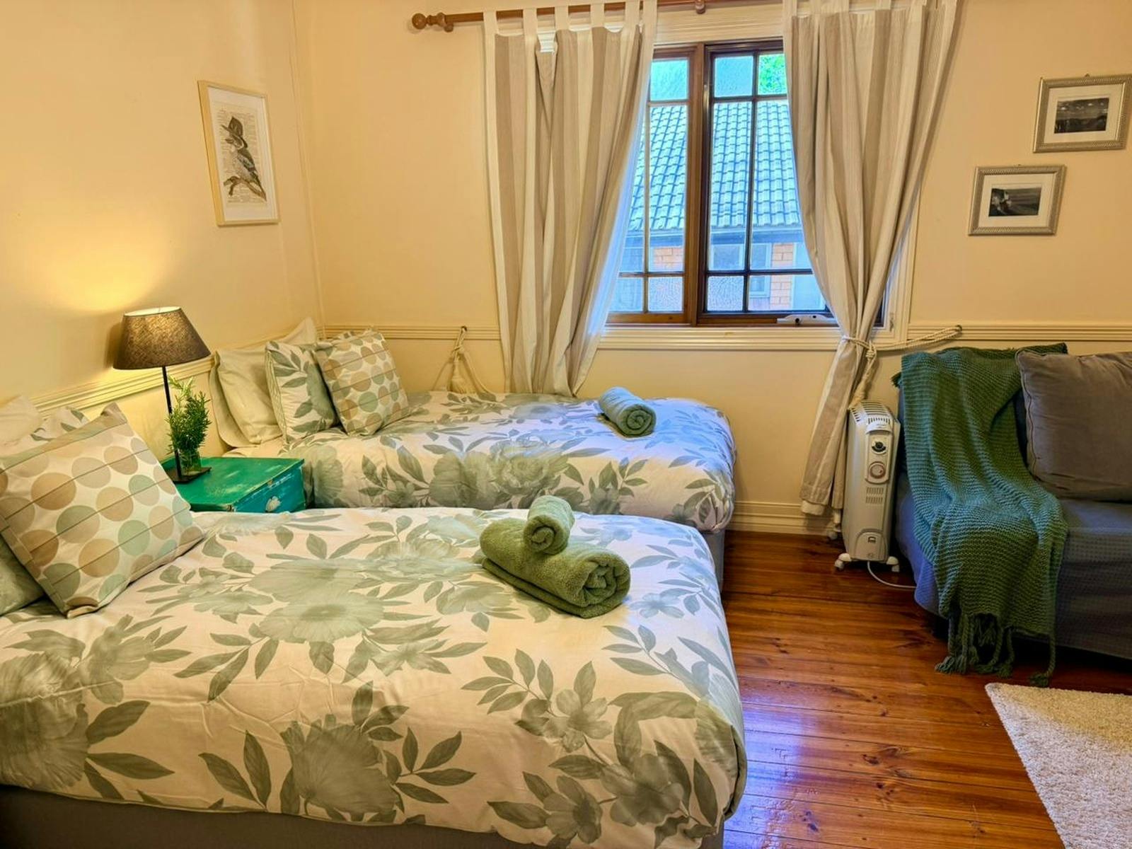 Wake up to garden views from cozy twin beds with electric blankets  pure comfort and calm.
