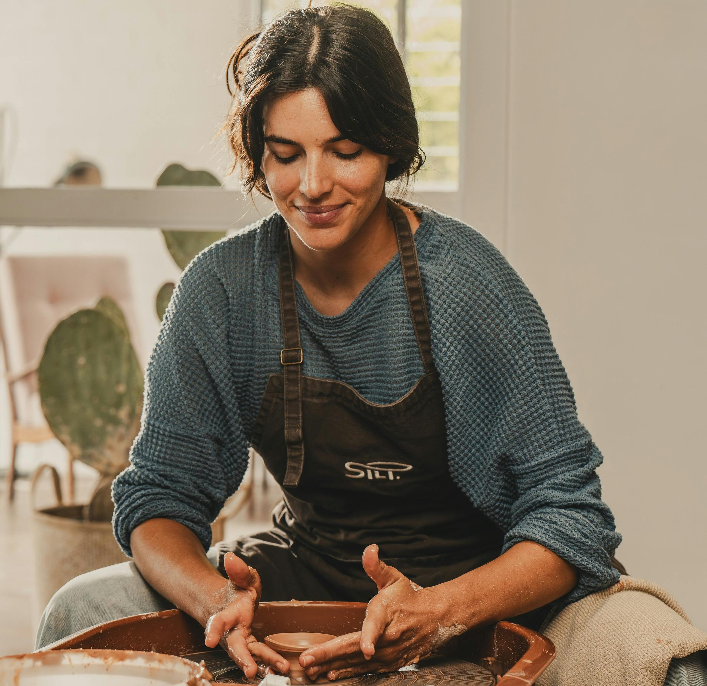 Woman working with clay