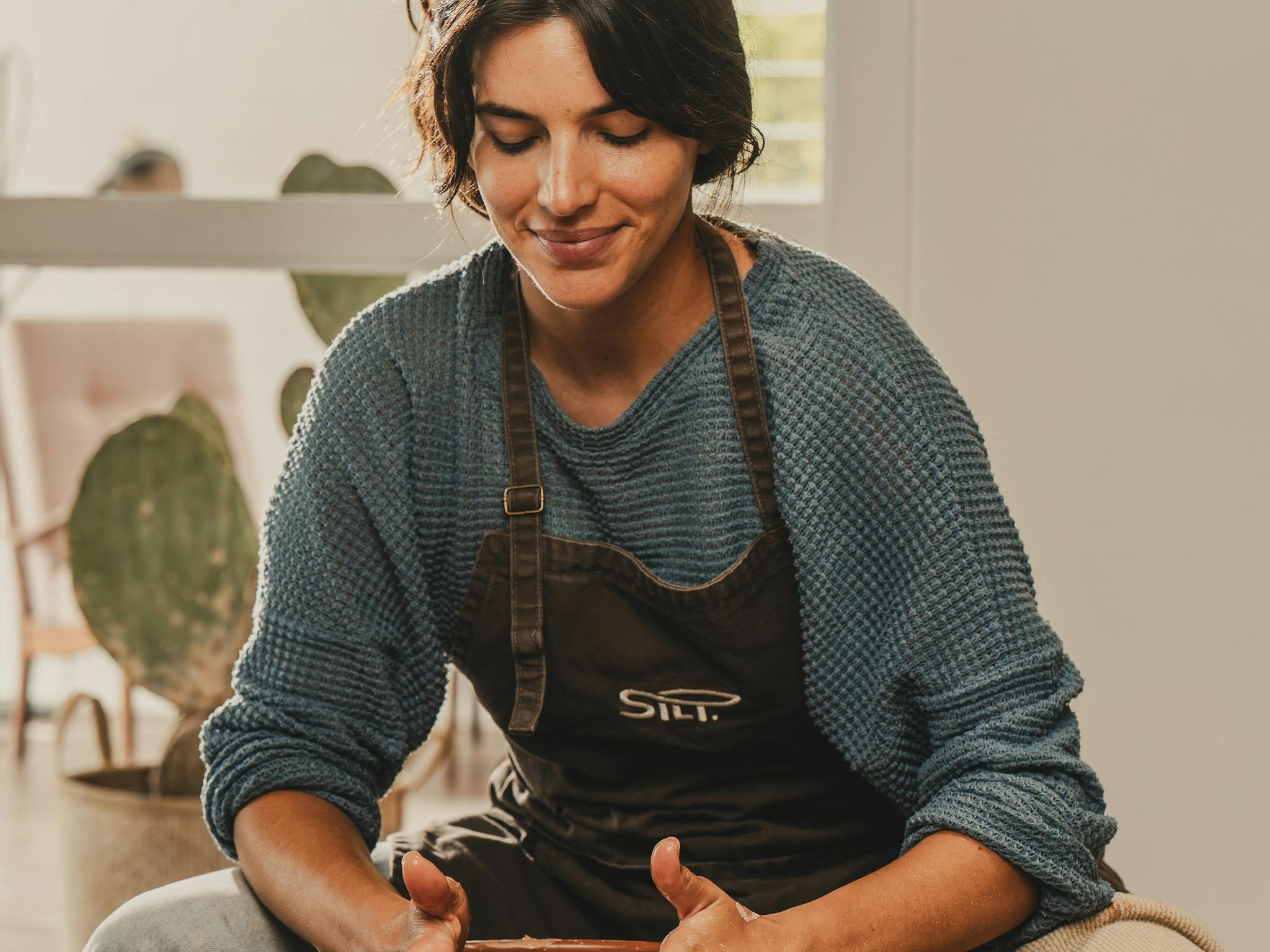 Woman working with clay
