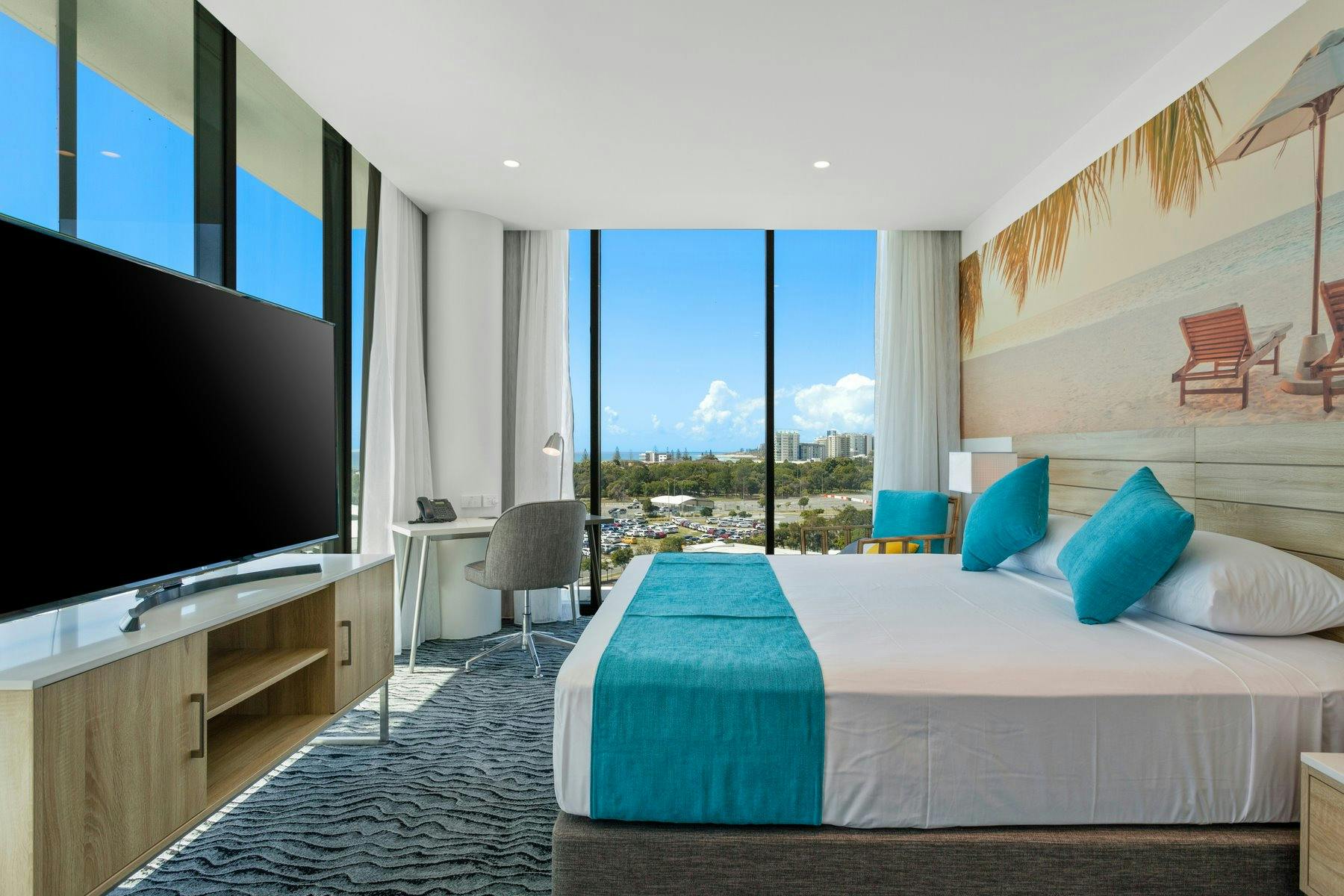 Coastal Executive Rooms at feature wrap around windows with views north to Surfers & south to Kirra