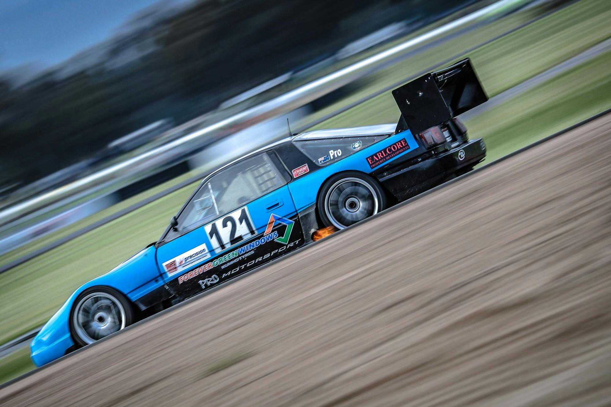 One blue race car on track