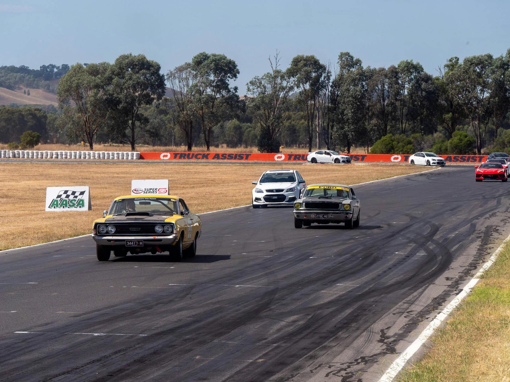 Mix of classic and modern cars on the racetrack
