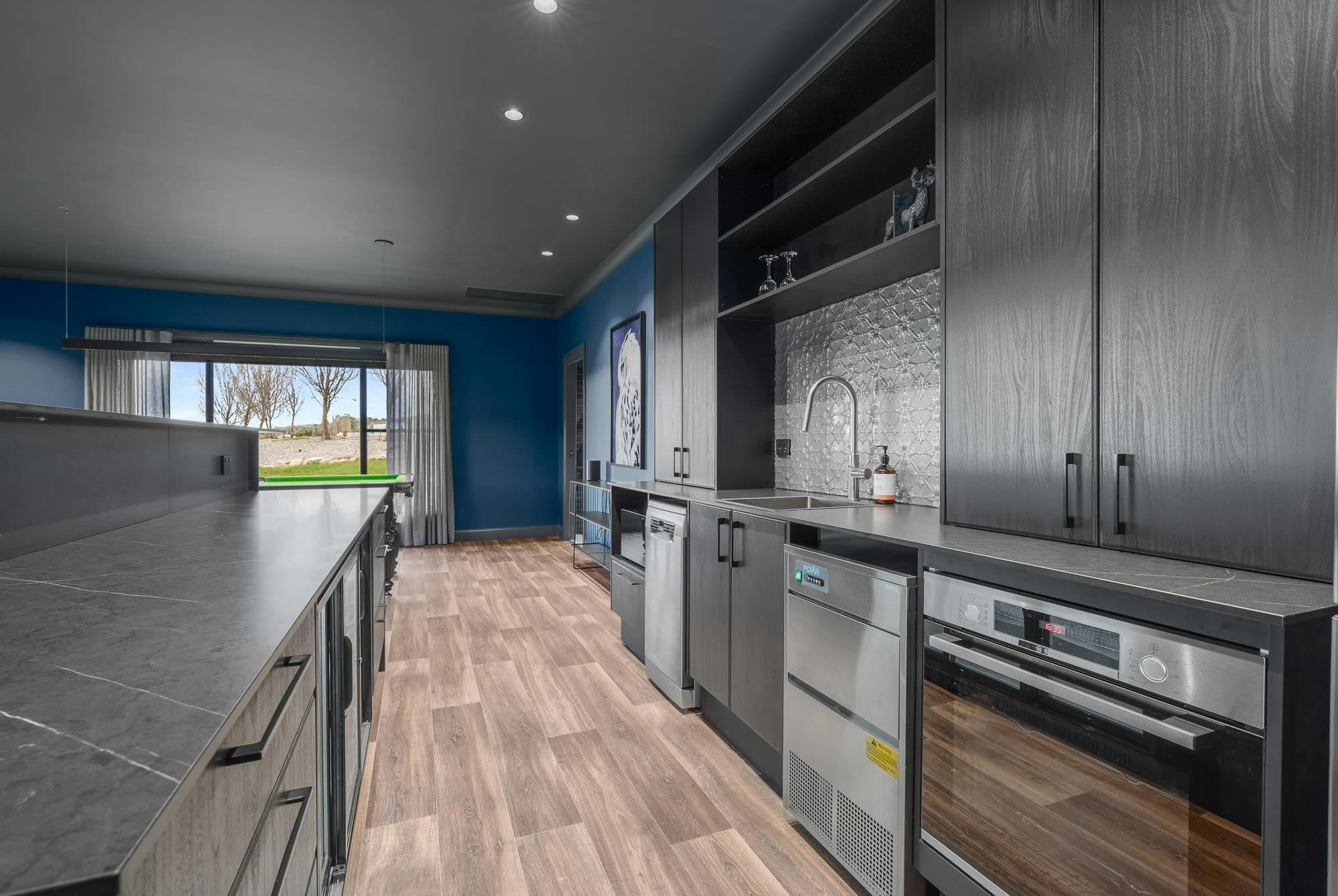 Large kitchen with appliances and amenities