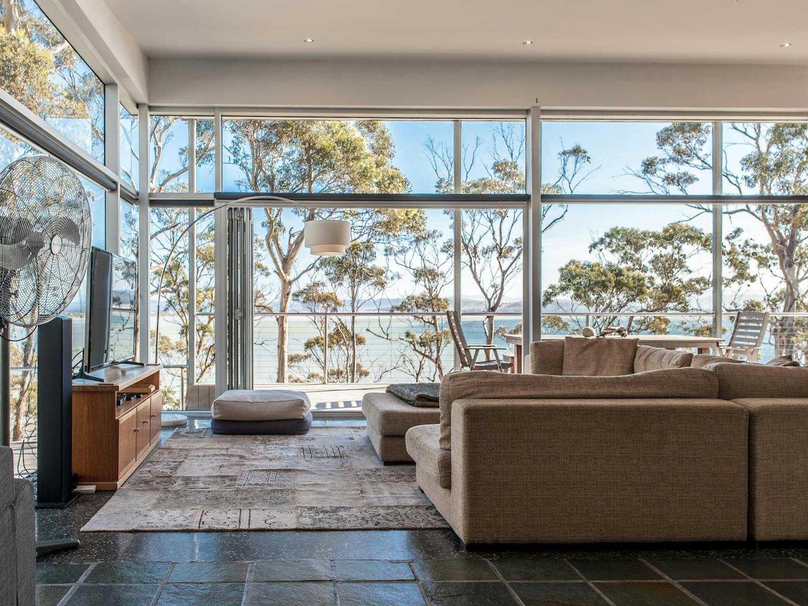 Floor to ceiling windows to capture those spectacular views. Large, comfy couches invite relaxation.