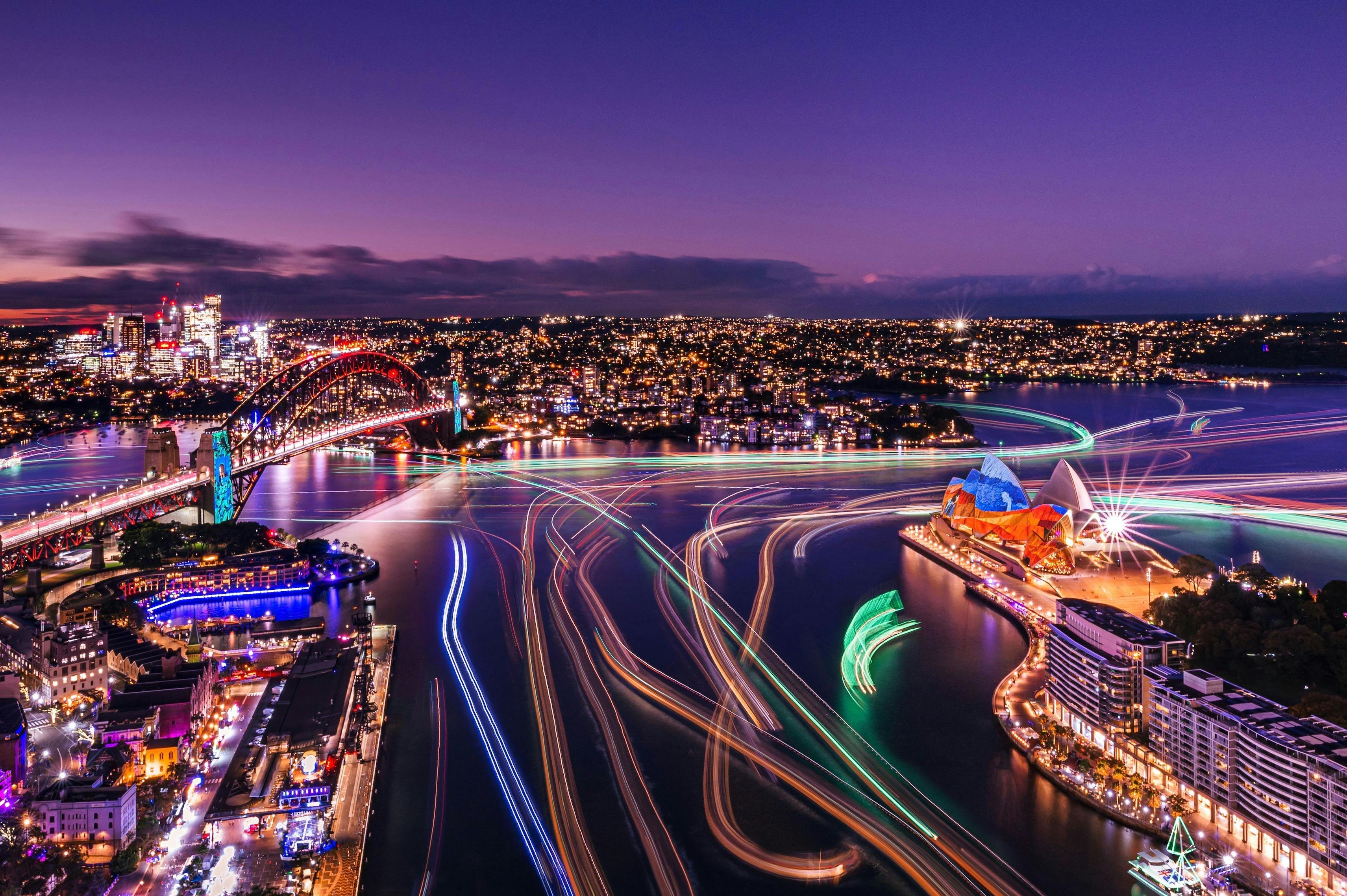 Multiple coloured lights paved across Sydney Harbour