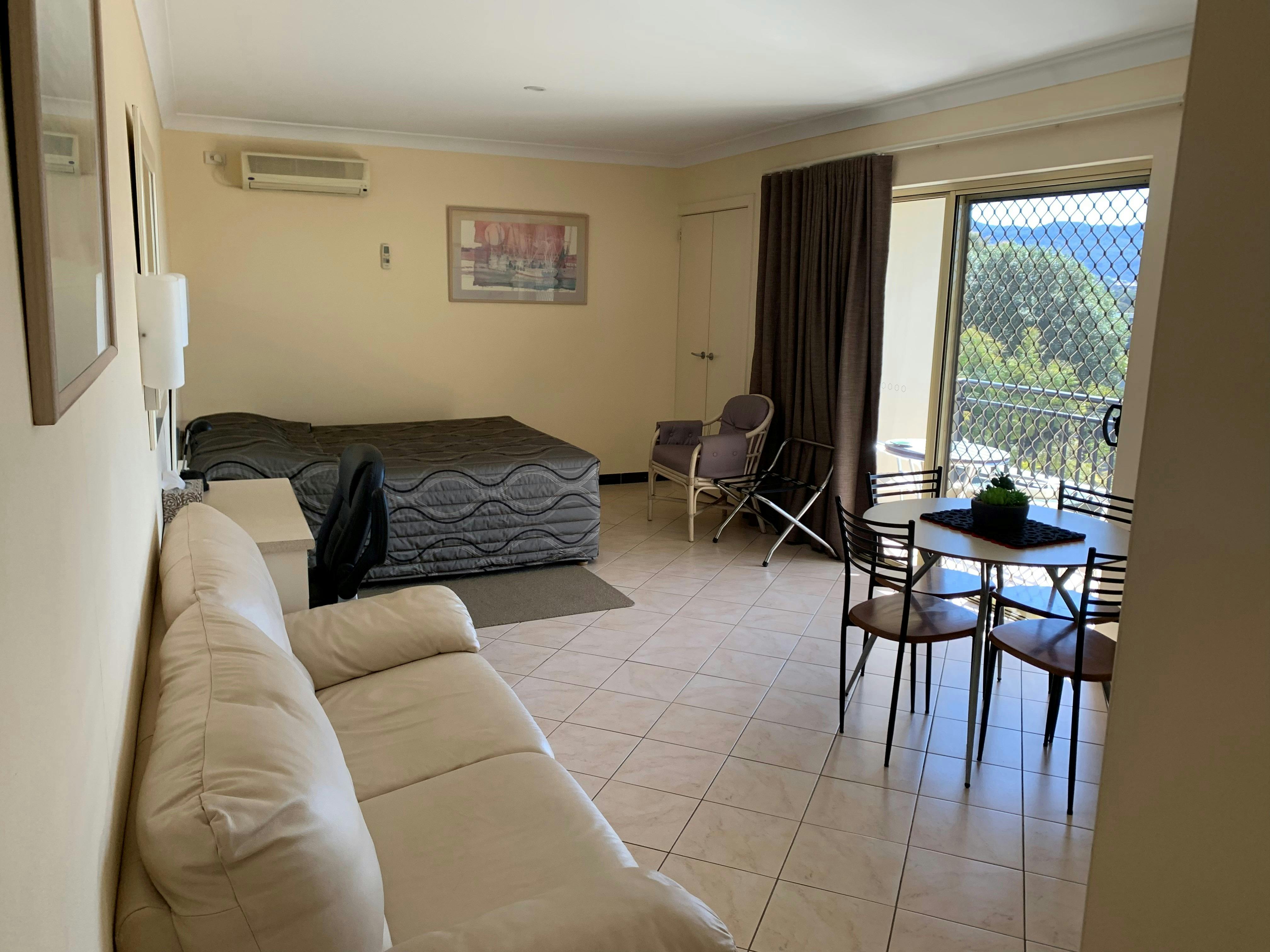 Queen size bed and balcony