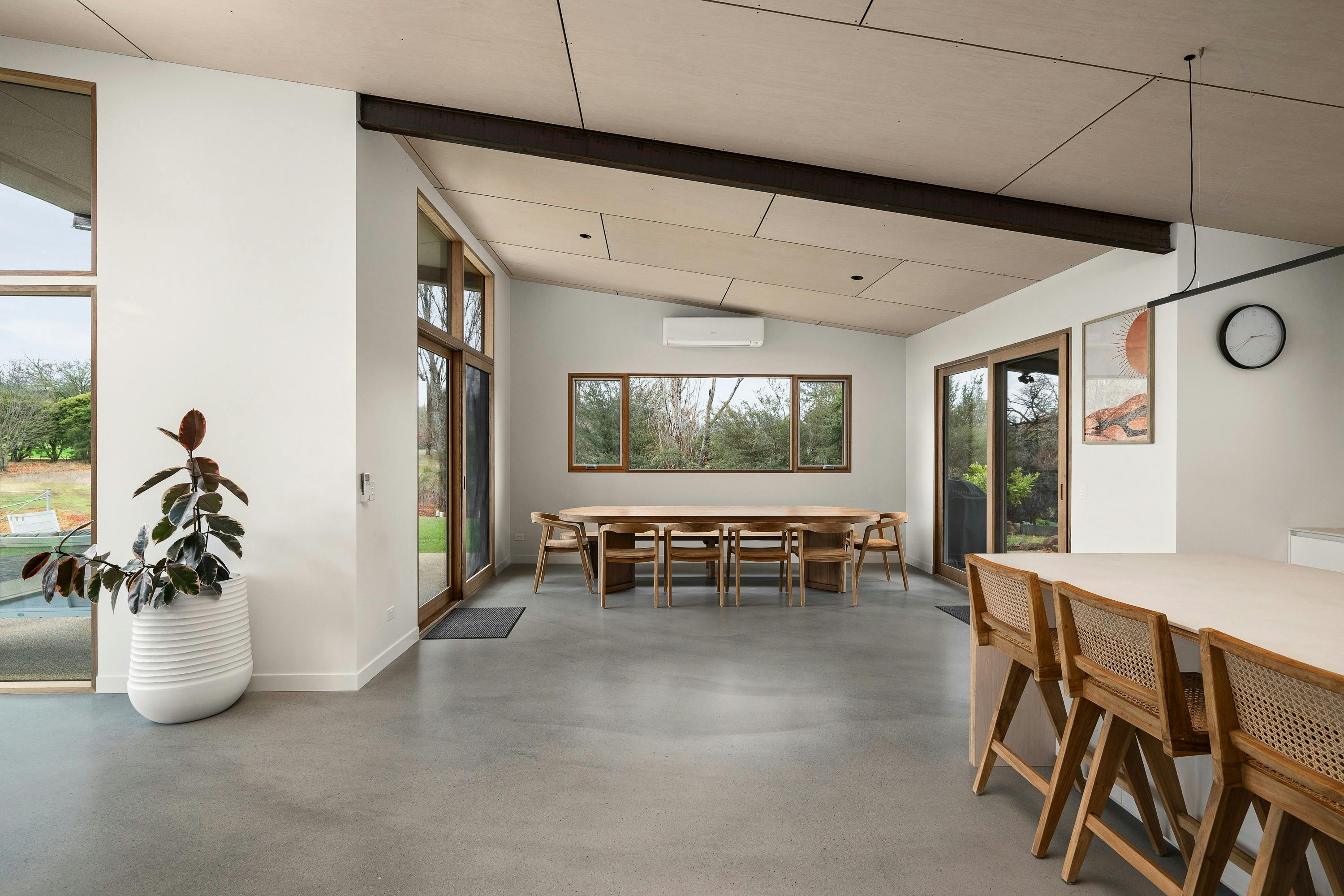 silver house , dining area with a long dining table