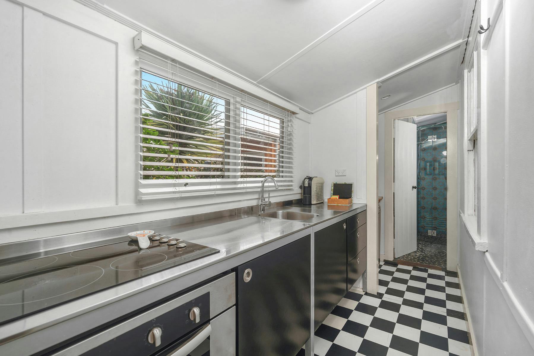 Atlantis kitchen, stainless benchtop, electric cooktop, oven and dishwasher