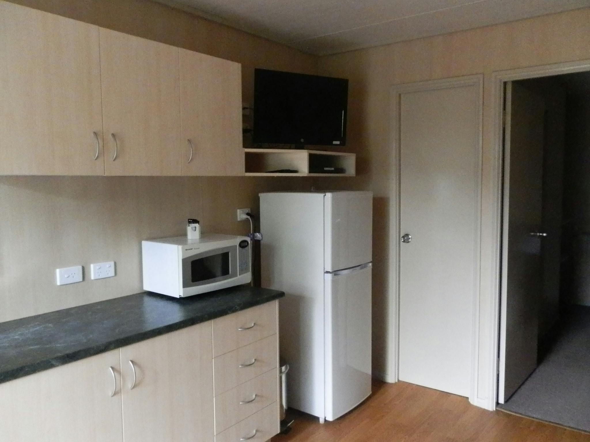 Kitchen area with domestic size fridge/freezer