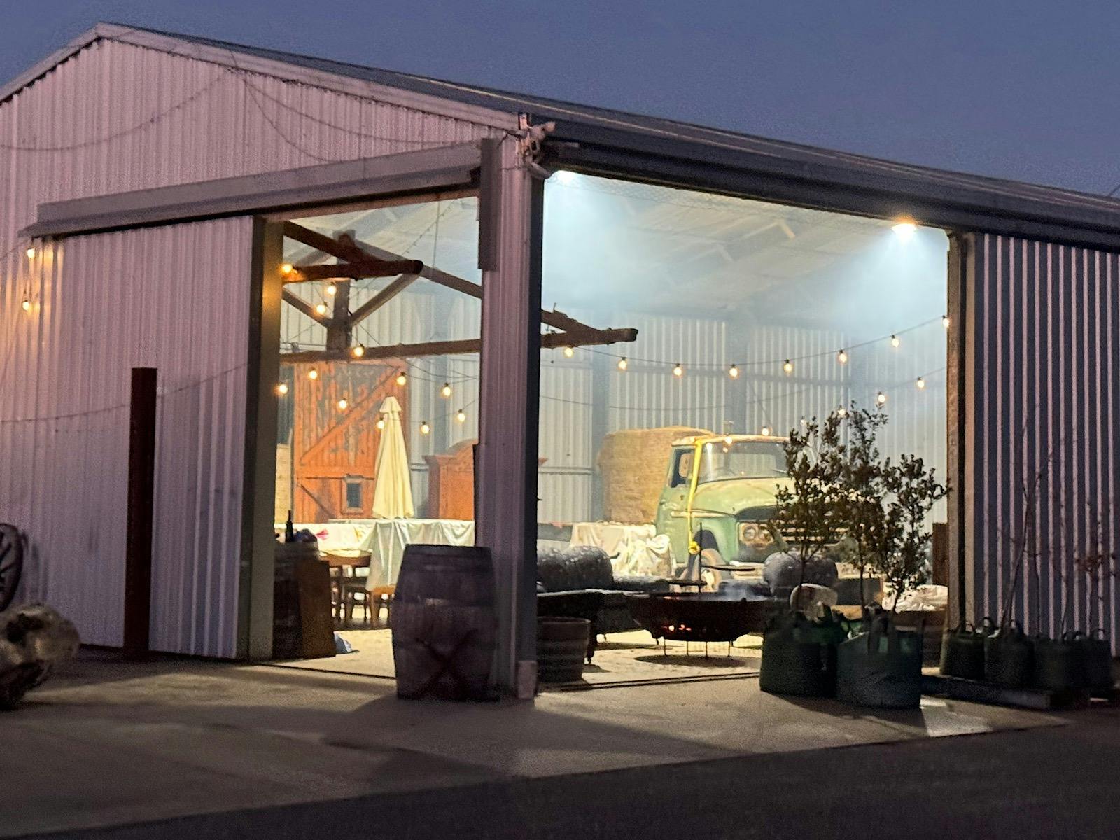 Rustic Shed with old farm truck and seating for Truffle & Flames Experience