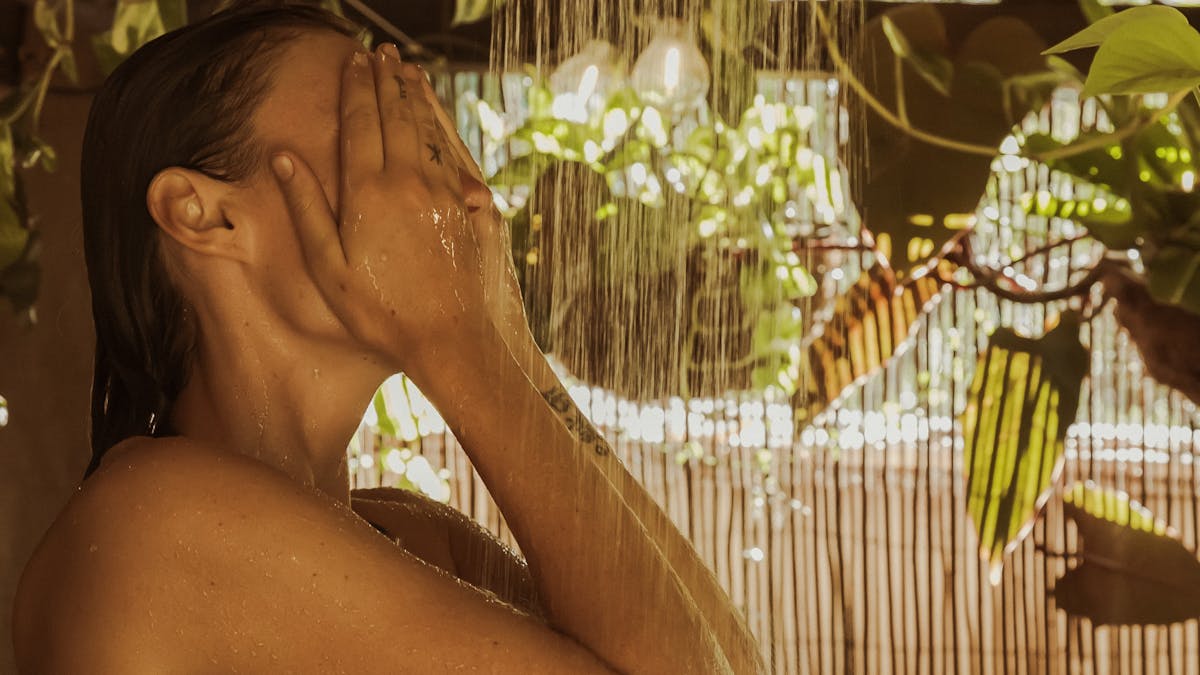 Person in outdoor shower