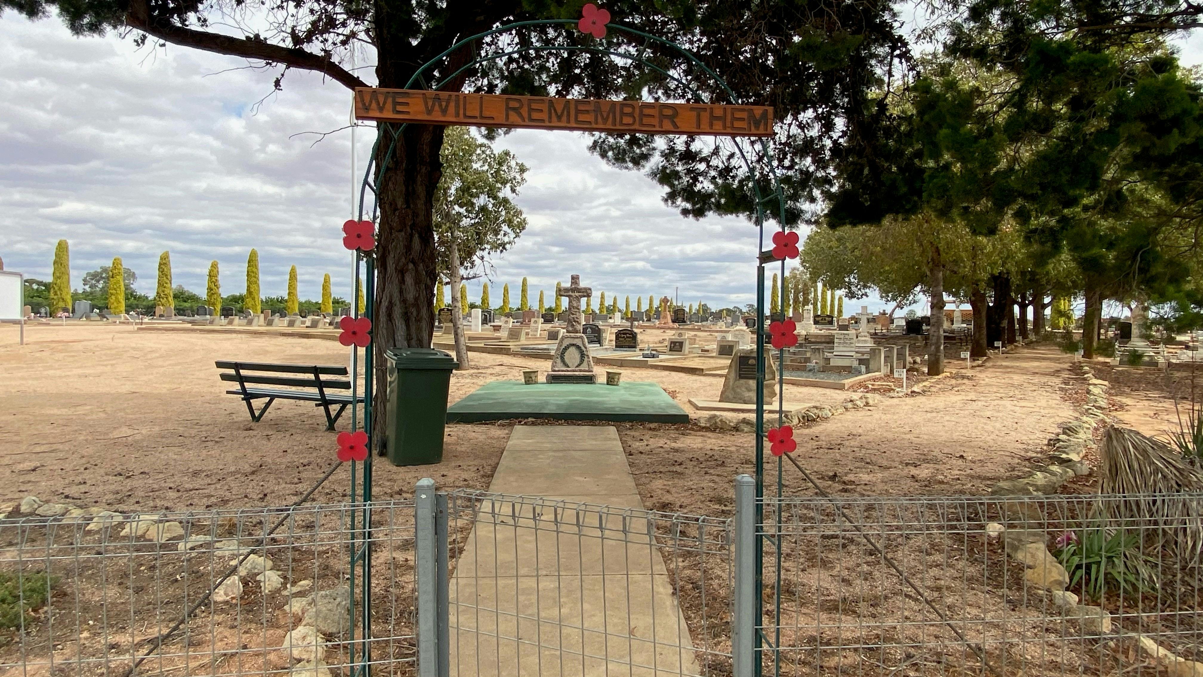 Road view of cross of sacrifice memorial from Strangman Rd at Waik Cemetery