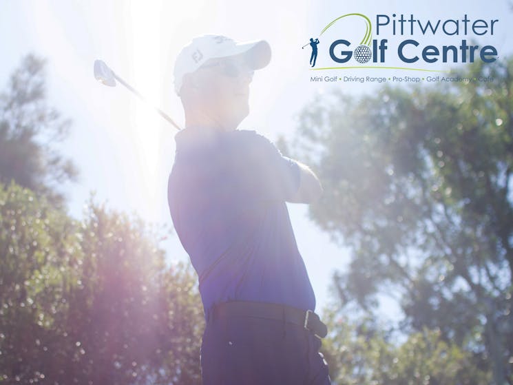 Pittwater Golf Centre - PGA Professional Leigh Hunter hits golf ball on driving range, Sydney