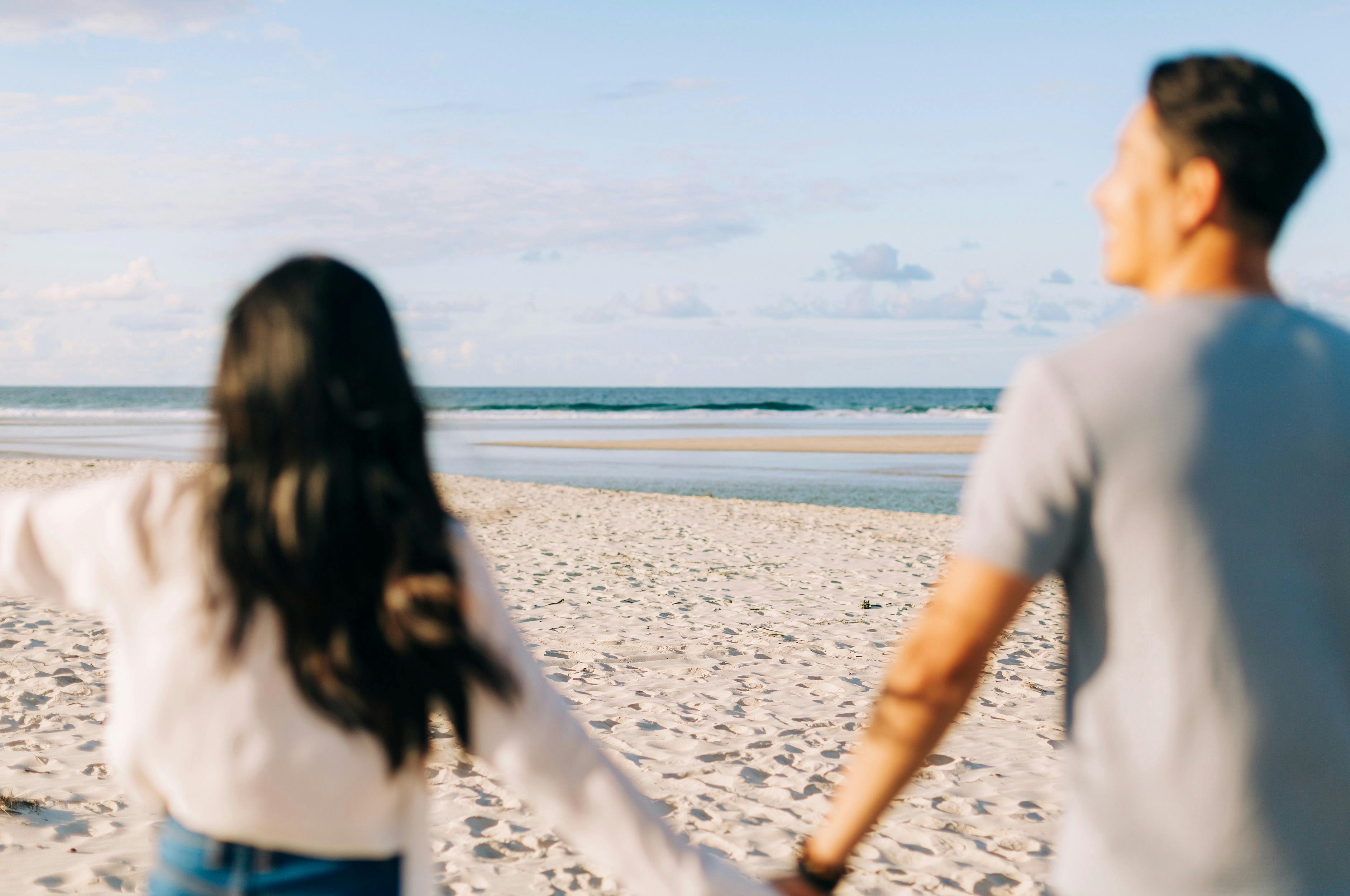 Couple enjoying a visit to North Belongil Beach, Byron Bay